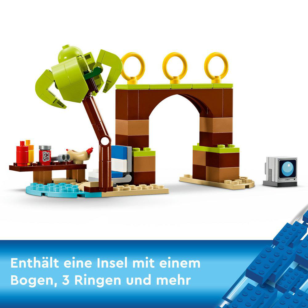 Lego Sonic the Hedgehog Set. Es zeigt einen braunen Bogen, einen Baum, drei Ringe und einen Fernseher.