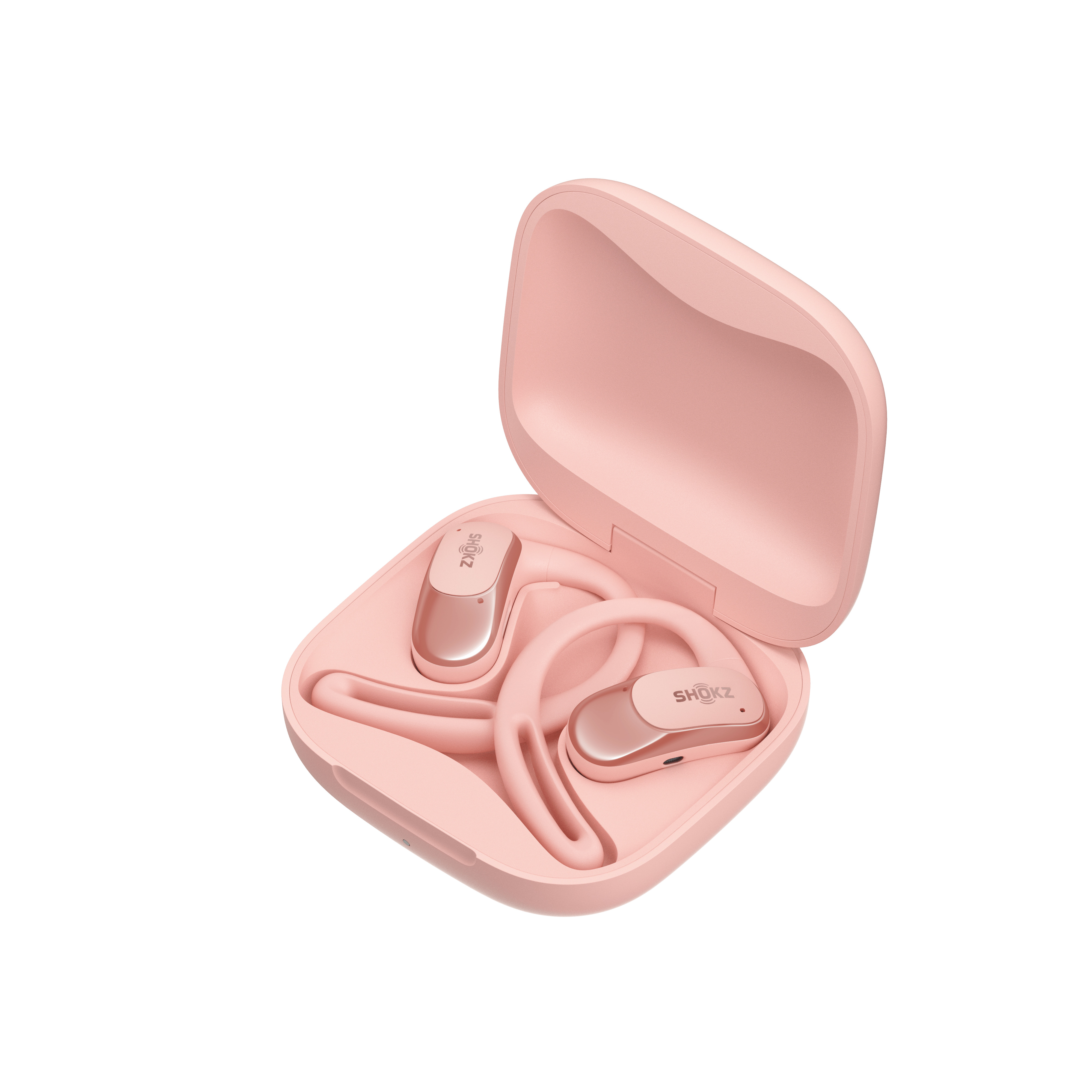 Pembe kulaklıkların içinde bulunduğu pembe bir şarj kutusu, beyaz bir arka plan üzerinde.