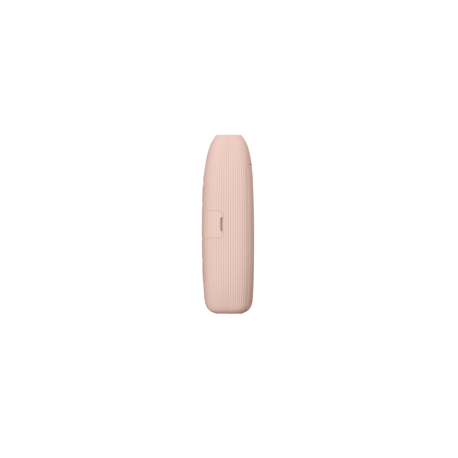 A small, pink, rectangular device with a slot. Black background.