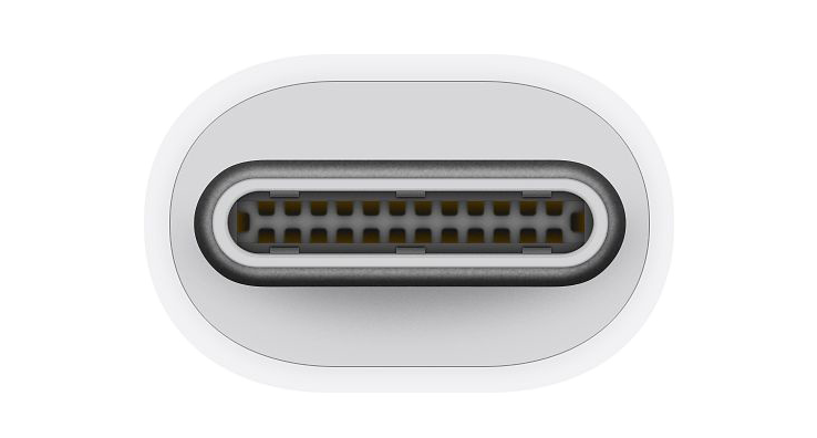 Fehér USB-C port közelről, számos arany színű érintkezővel.