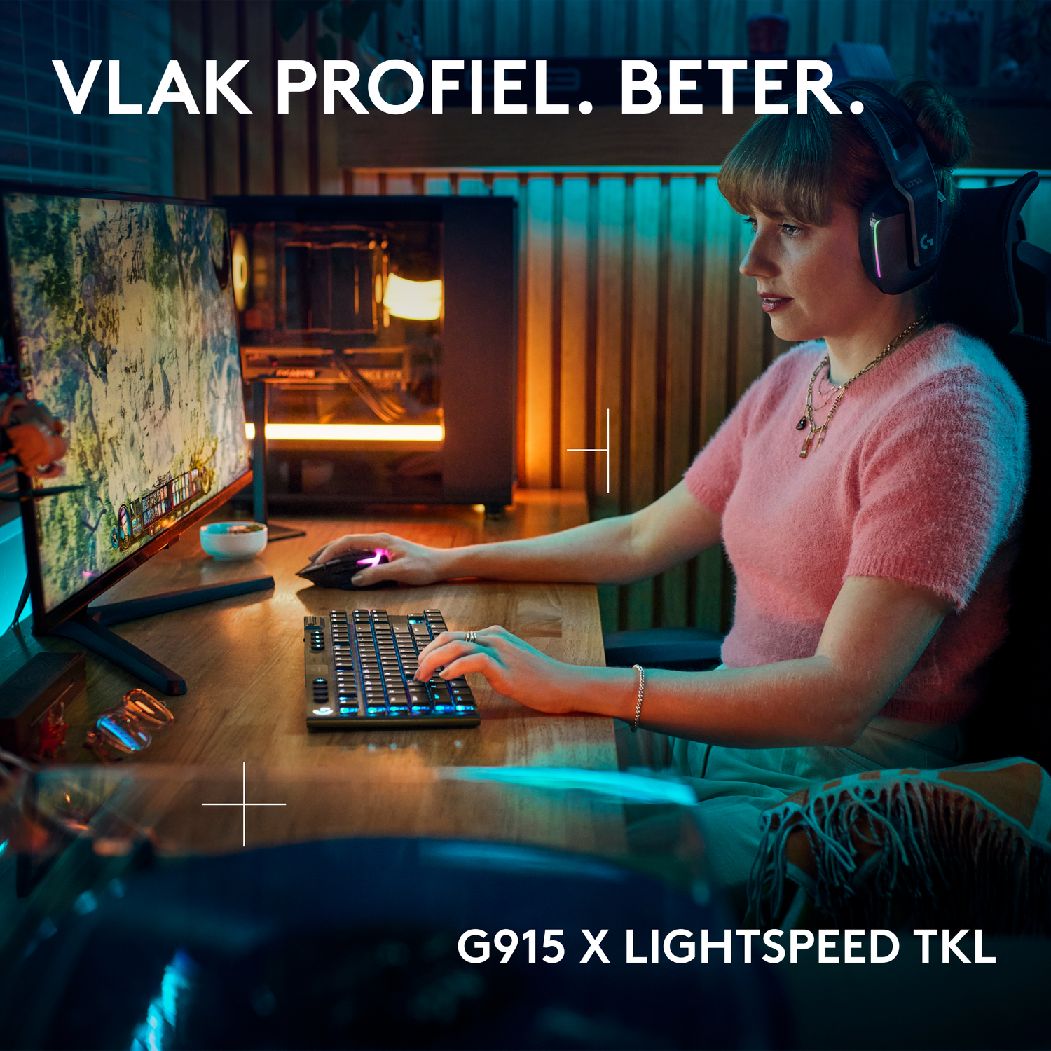 Woman gaming on a computer with keyboard and headset.