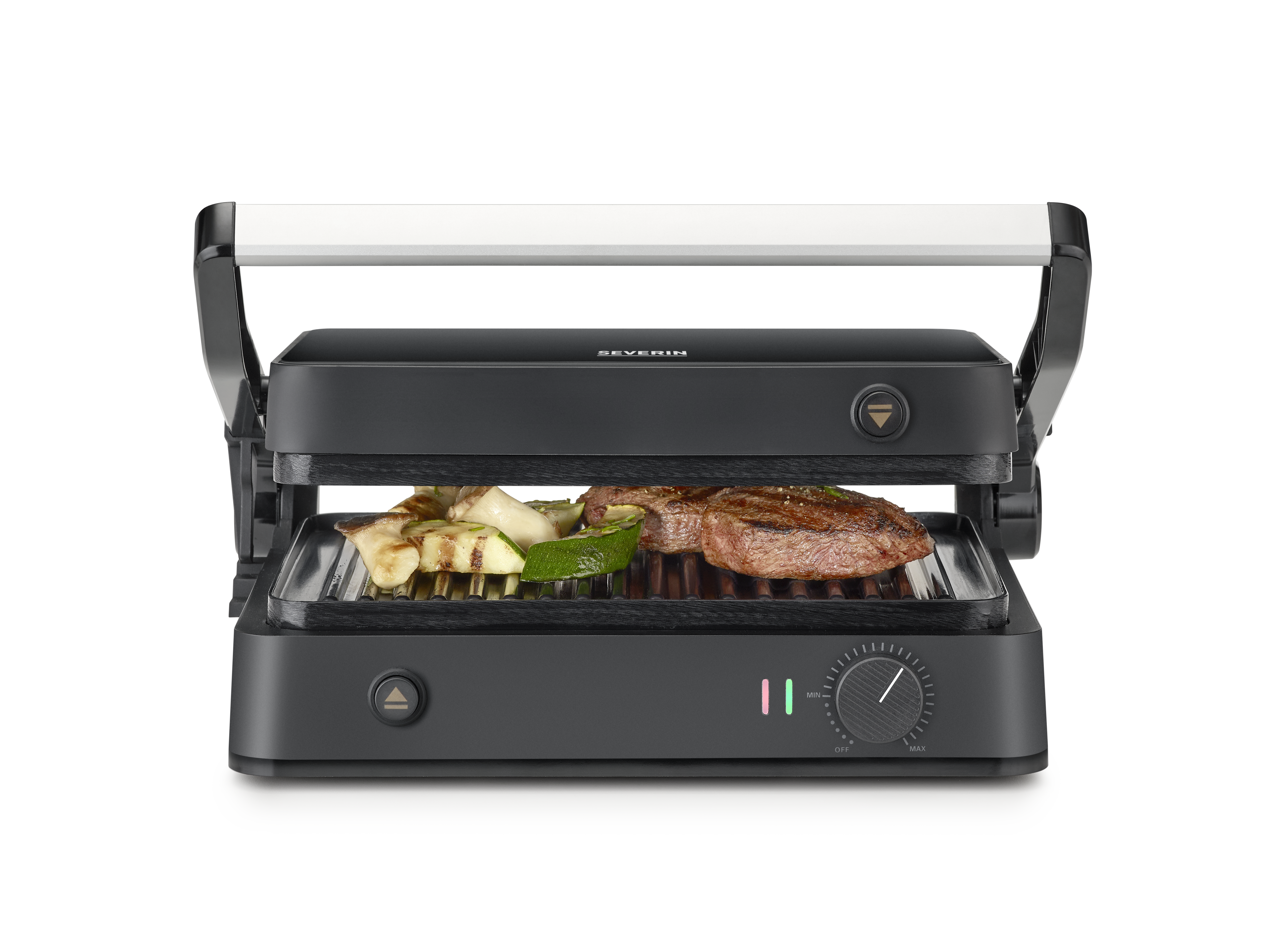 Ein schwarzer Severin-Grill mit gegrilltem Gemüse und Steaks. Der Griff ist weiß, Knöpfe sind sichtbar.