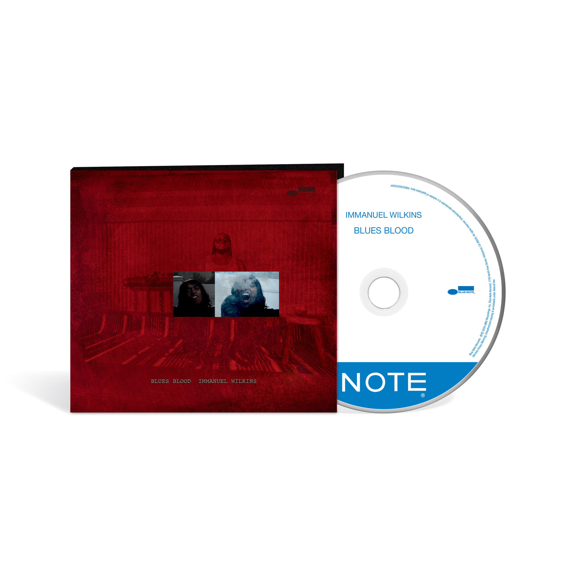 Albumcover mit CD. Das Cover ist rot mit Albumtitel und Künstler. Die CD hat ein blaues Etikett.