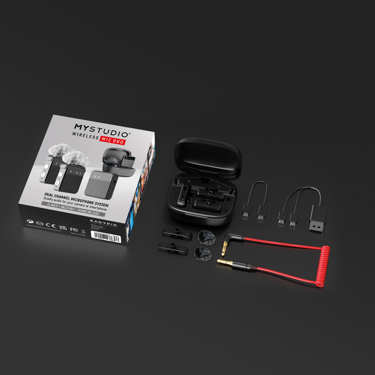 Un set di microfoni wireless in una scatola. Contiene microfono, ricevitore, cavi e accessori.