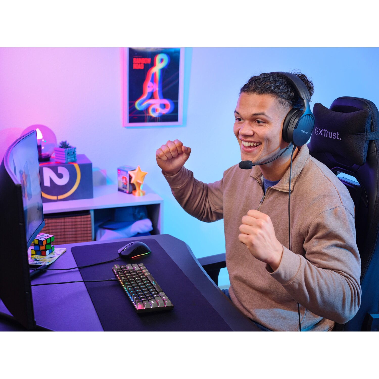 Man wearing headset smiling while playing video game.
