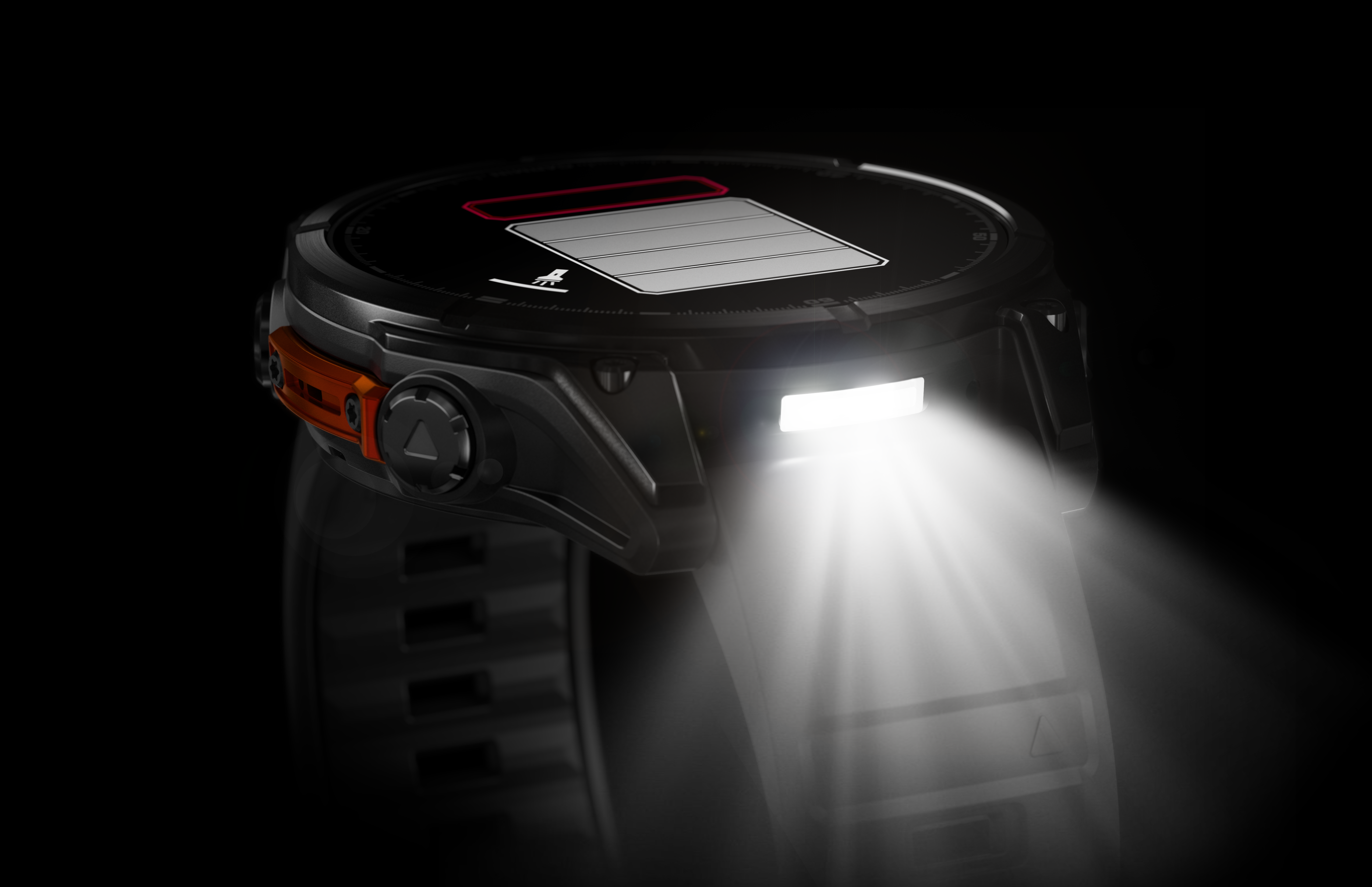 Montre connectée noire avec lumière allumée. Le bracelet est visible. Lumière brilllant. Fond noir.