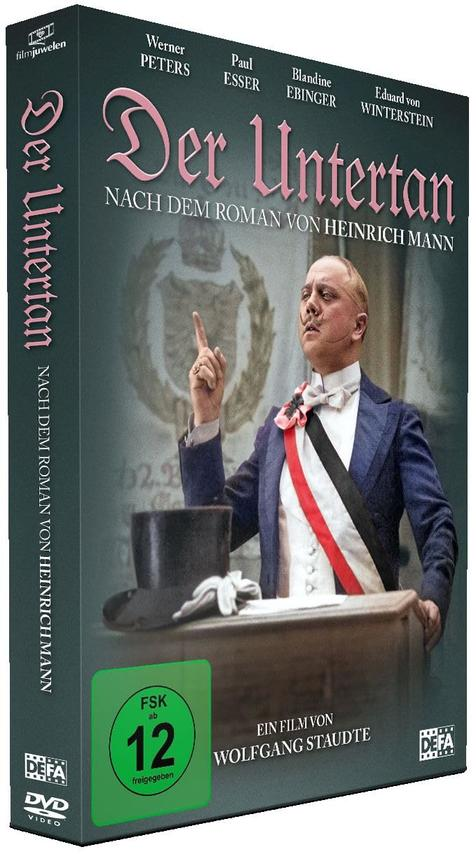 DVD-Box für Der Untertan, zeigt einen Mann im Anzug, der nach oben zeigt, mit deutschem Text und Logo.