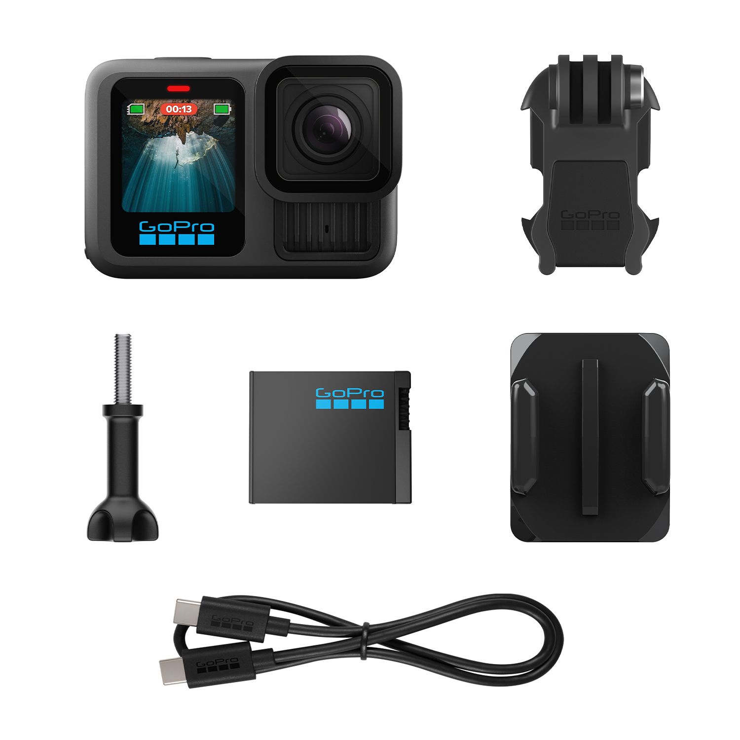 Fotocamera GoPro con accessori: supporti, batteria e cavo di ricarica.