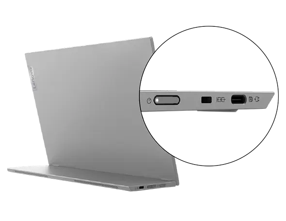 Silberner Laptop, Seitenansicht, mit Nahaufnahme der Anschlüsse. Anschlüsse umfassen USB, Laden und Audio.