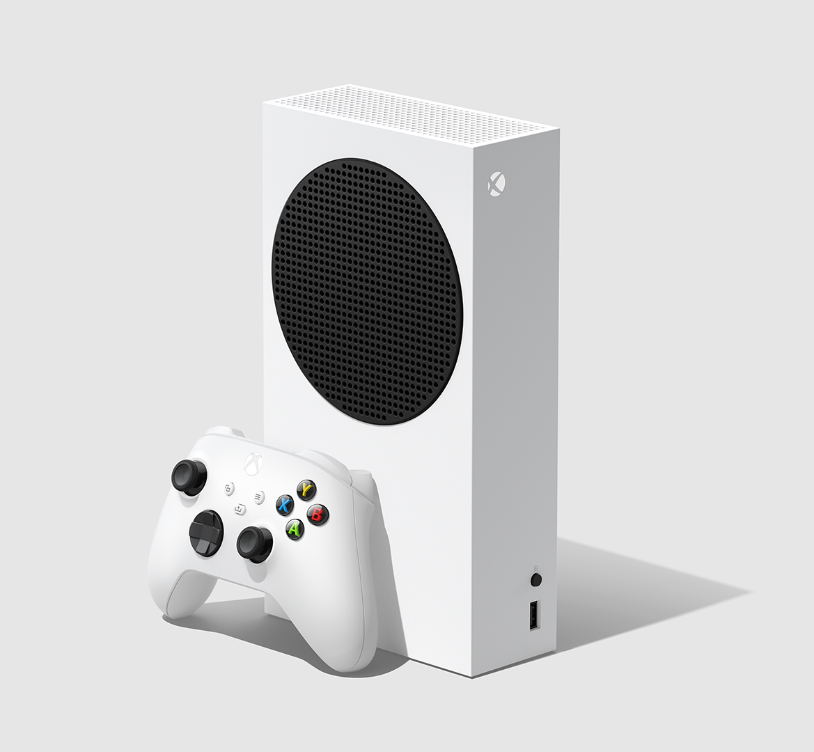 Fehér Xbox Series S konzol és hozzáillő kontroller világosszürke háttéren.