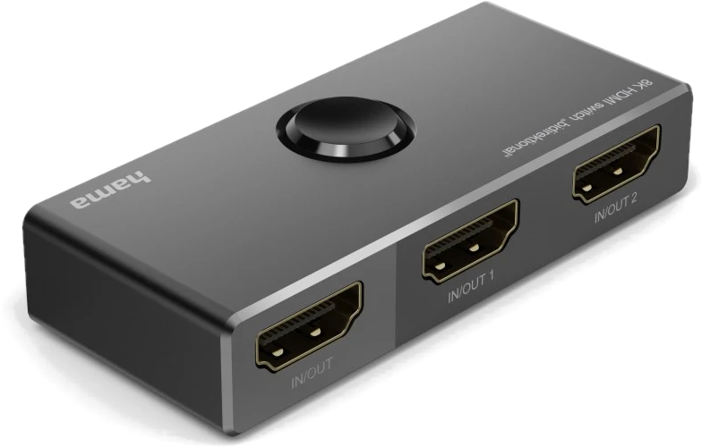 Un commutateur HDMI noir avec trois ports et un bouton rond. Les ports sont étiquetés.