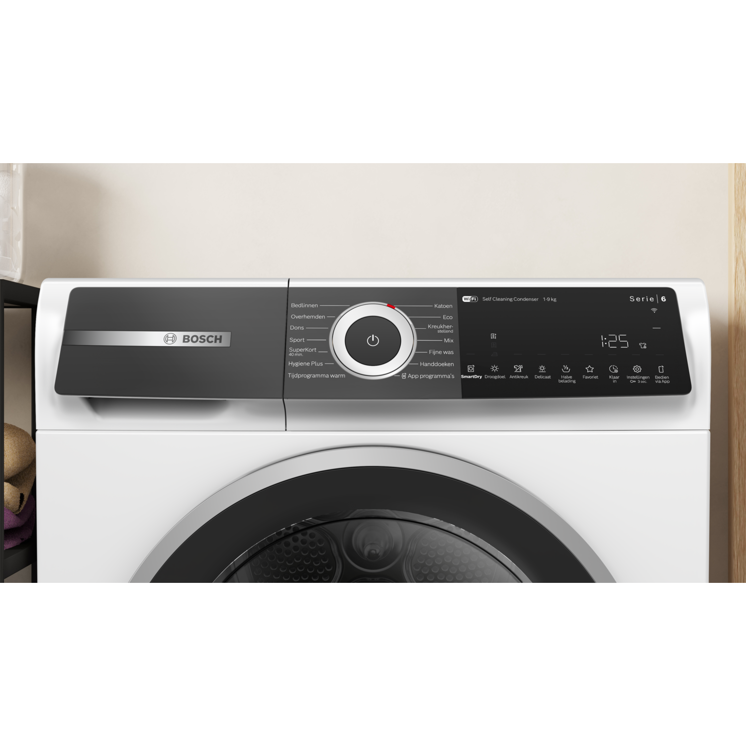A white Bosch dryer with a black control panel. Features include program settings, a digital display, and various buttons.