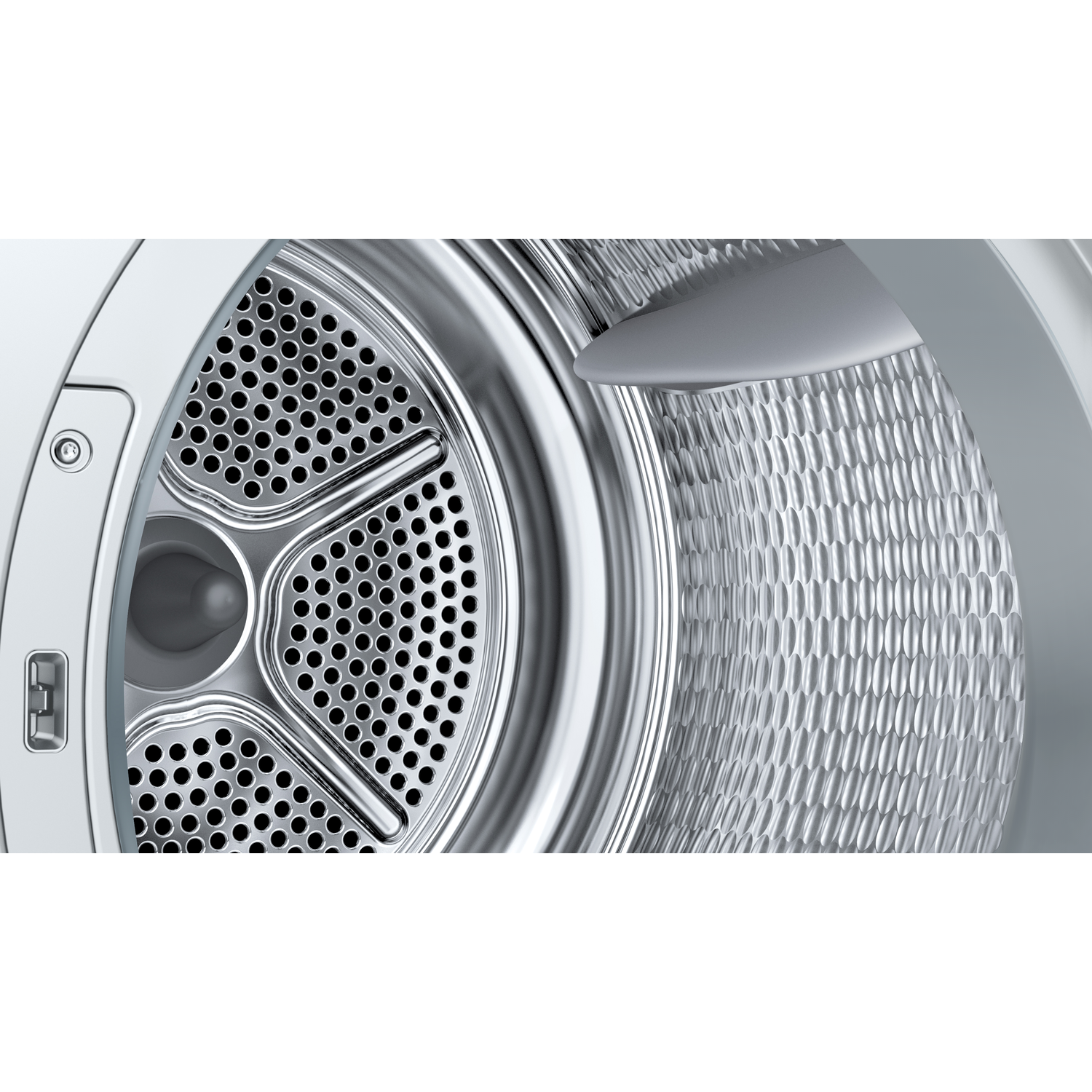 Close-up of a washing machine drum. The drum is metallic with many holes. The interior is visible.