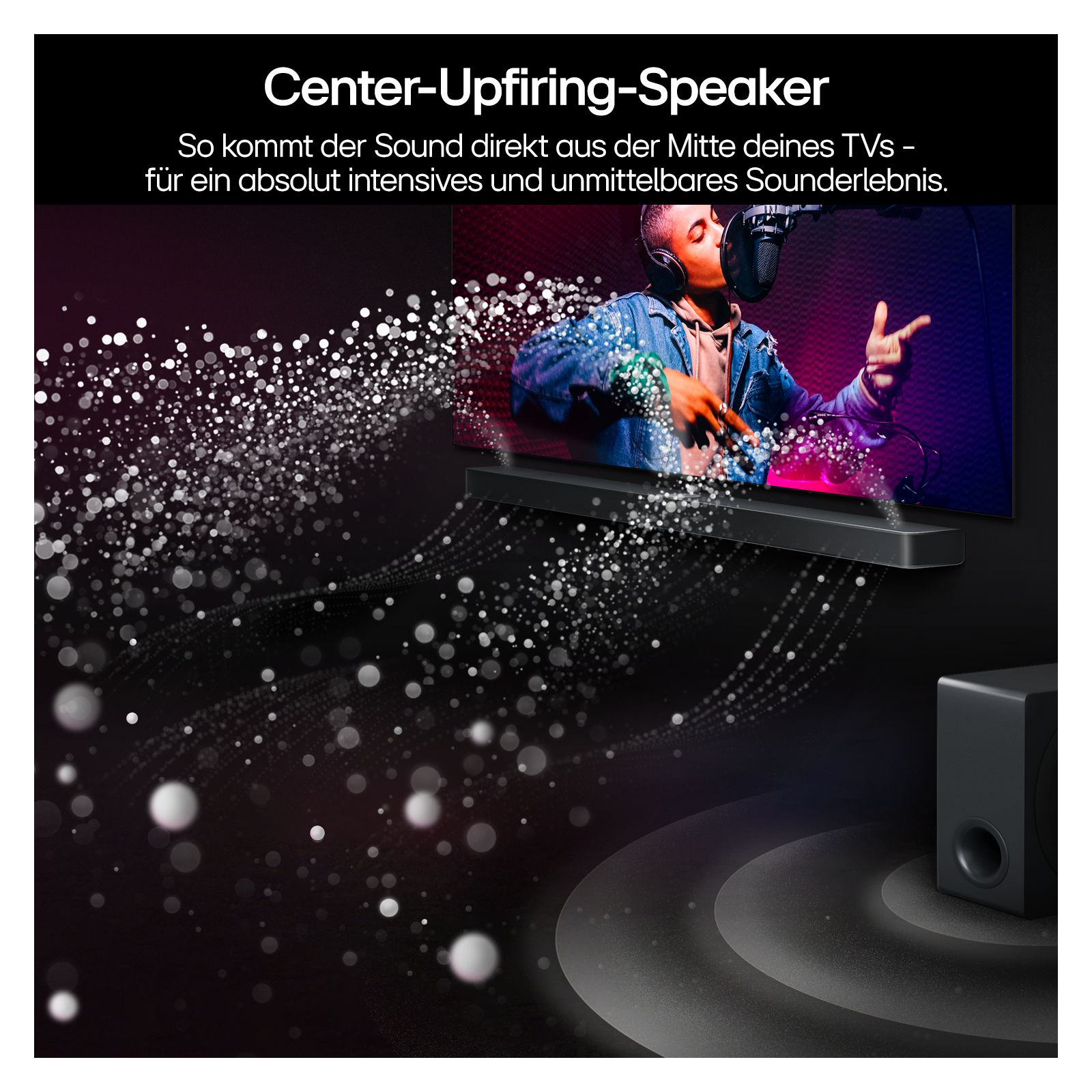 Eine schwarze Soundbar mit einem Fernseher, der einen Sänger zeigt, einem Subwoofer und weißen Punkten.