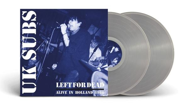 Album borító és két ezüst bakelit lemez. A borítón egy fekete-fehér fotó látható egy zenekarról.