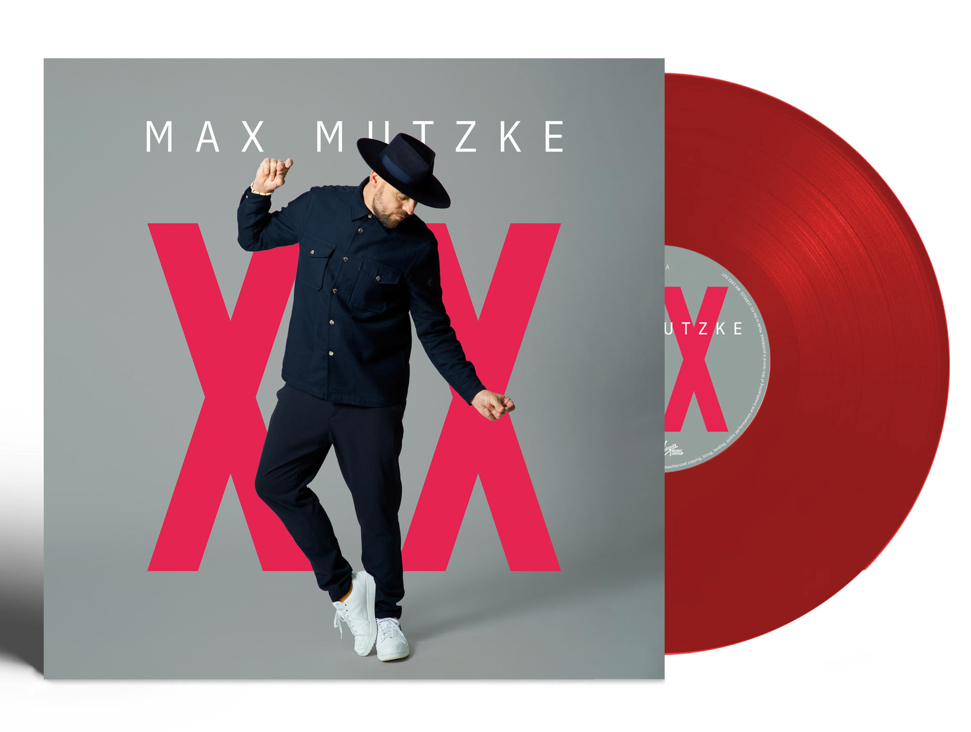 Rote Vinylplatte mit Max Mutzke Albumcover. Mann in schwarzem Anzug tanzt.