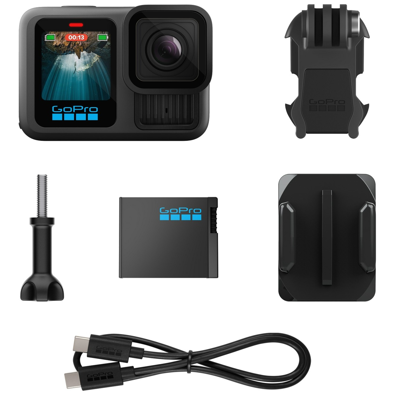 A GoPro camera with accessories, including a battery, mounts, and a charging cable.
