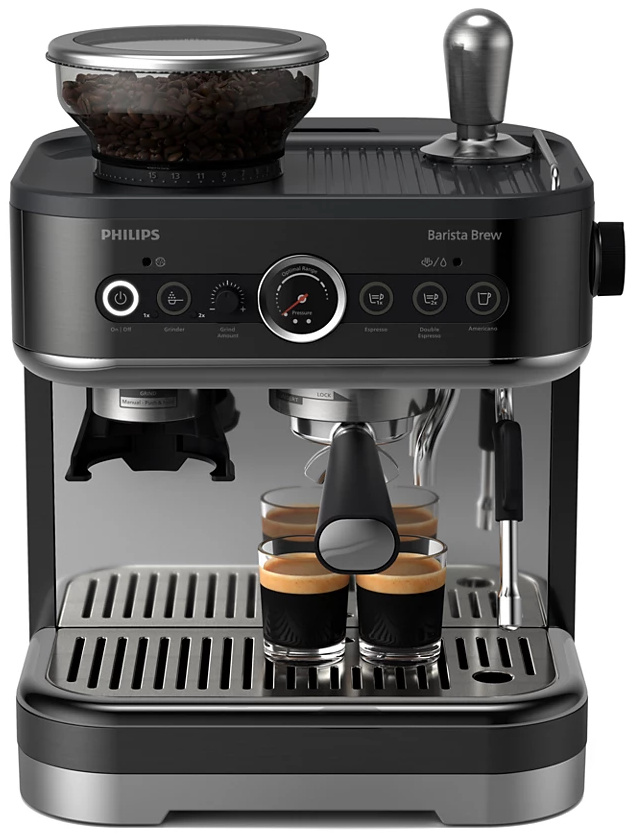 Fekete és ezüst eszpresszó gép. Van egy őrlője, kávébabja és két kis csésze kávéval.