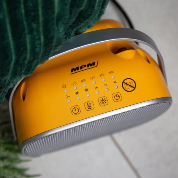 Żółty grzejnik z panelem sterowania pokazującym ustawienia temperatury.