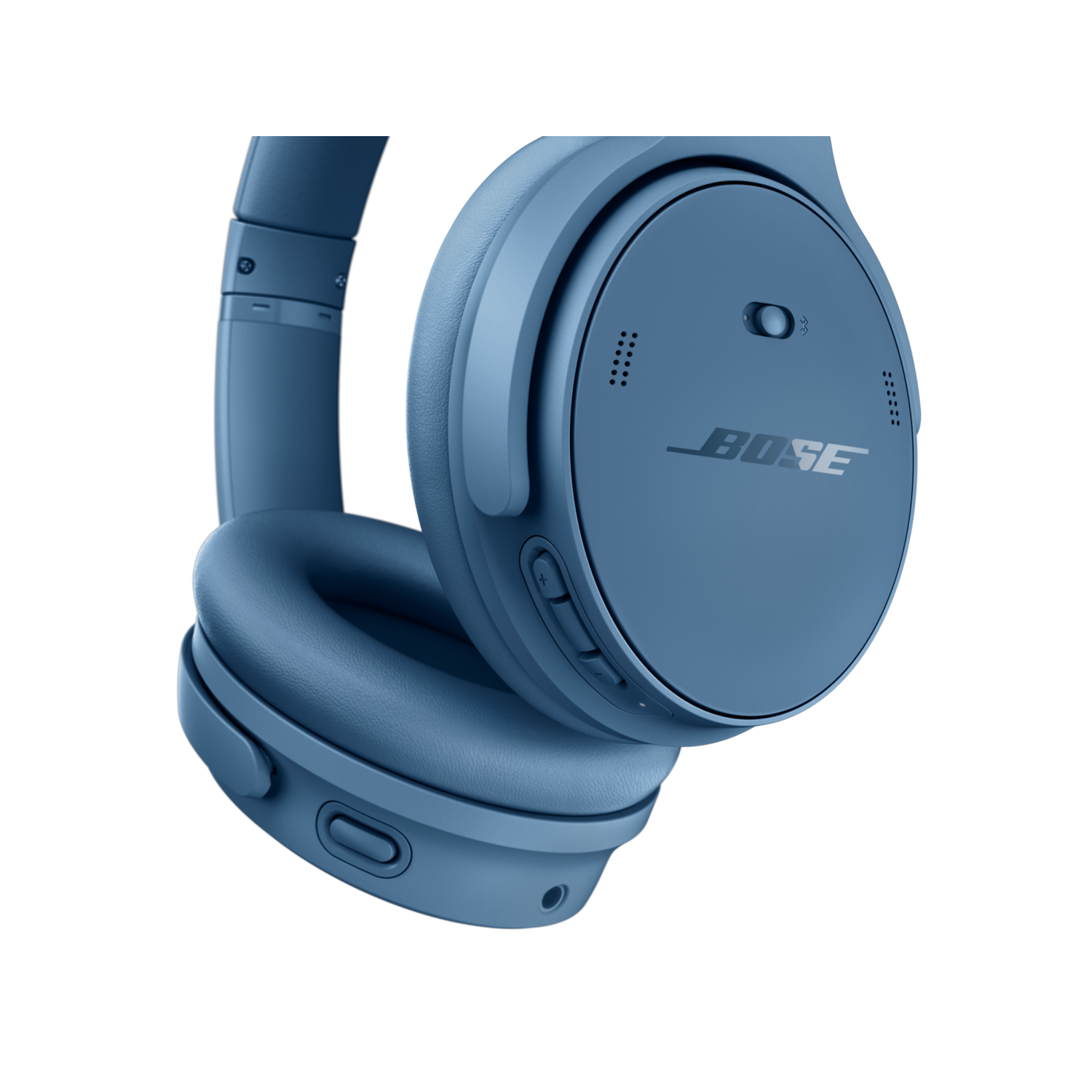 Blue headphones with Bose logo. Buttons on the side. Black background.