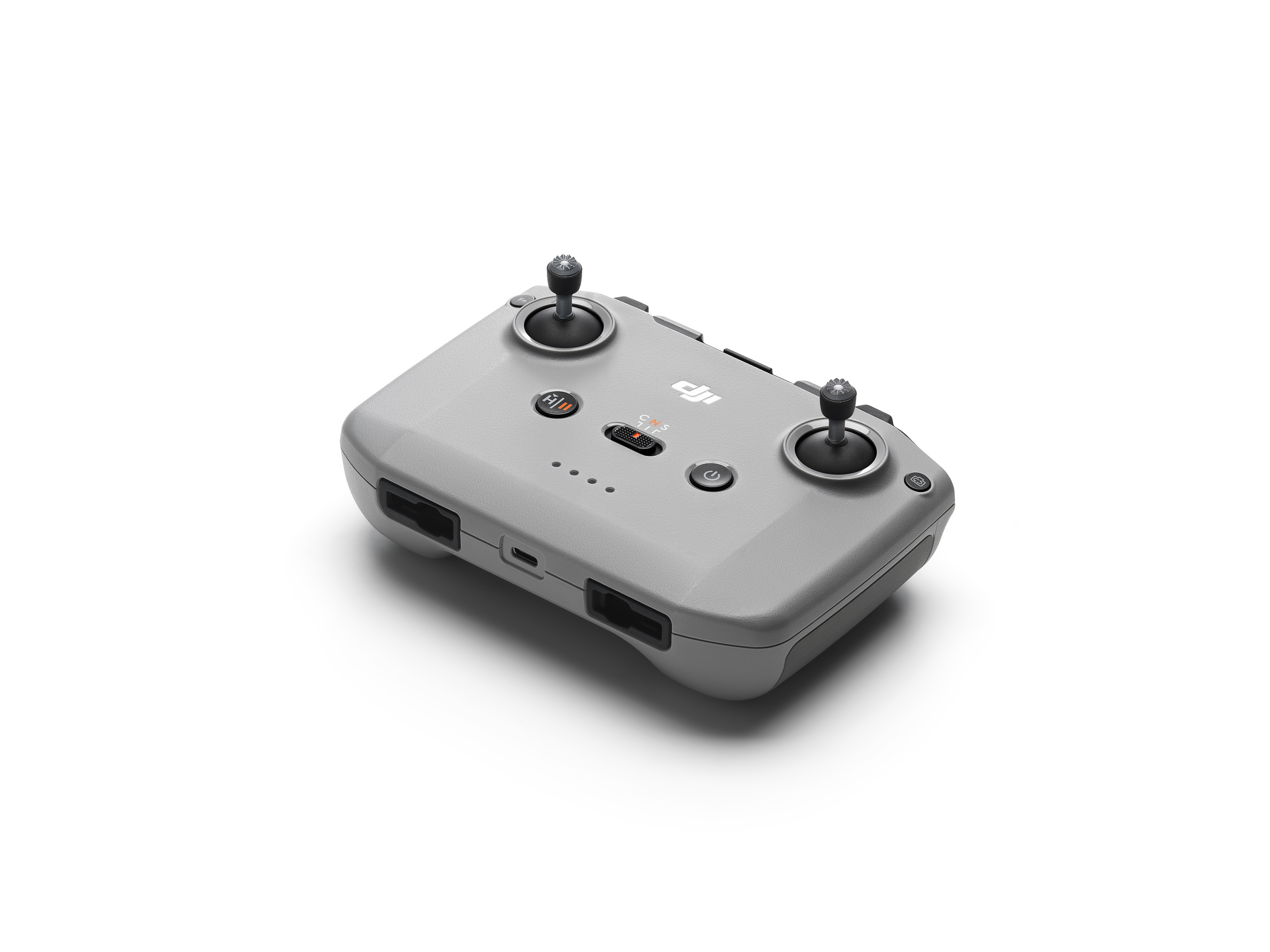 Eine graue Drohnen-Fernbedienung mit zwei Joysticks.