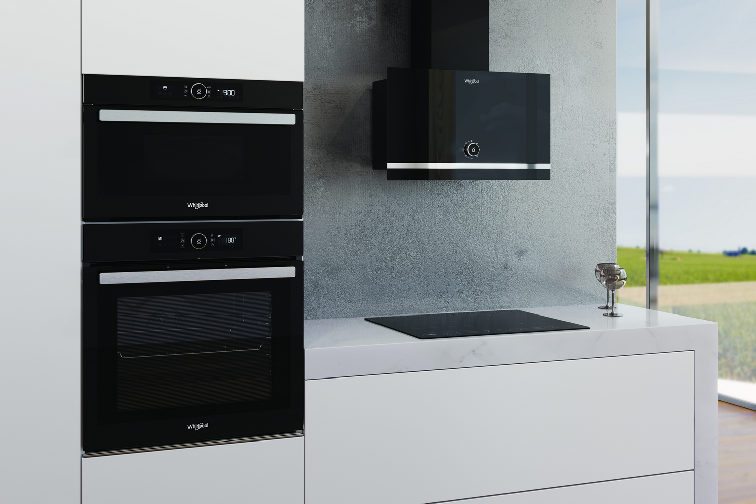 Una escena de cocina con electrodomésticos negros. Horno, microondas y campana extractora sobre una encimera blanca.