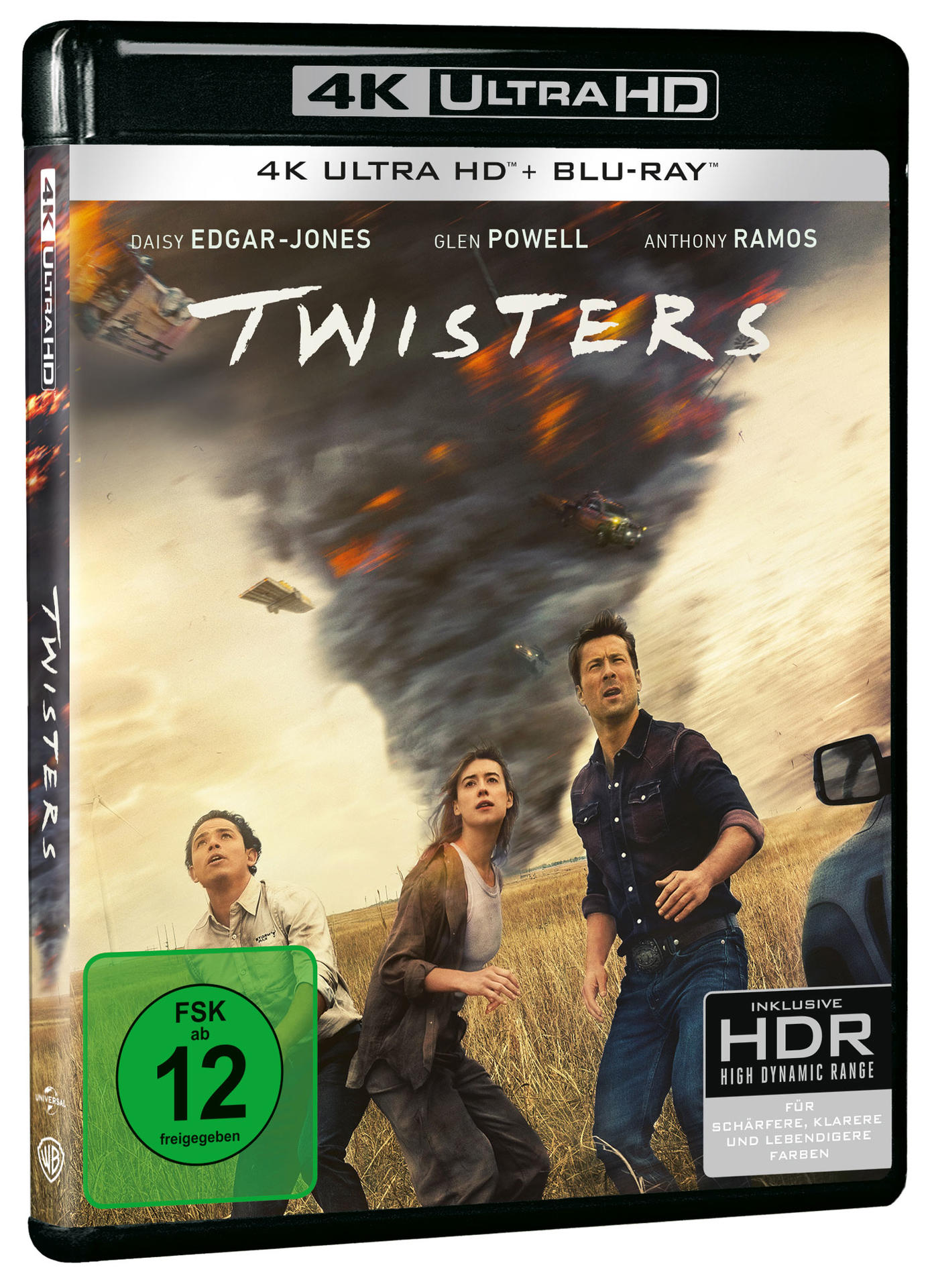 Filmcover von 'Twisters'. Menschen schauen auf einen Tornado, Flugzeugtrümmer am Himmel.