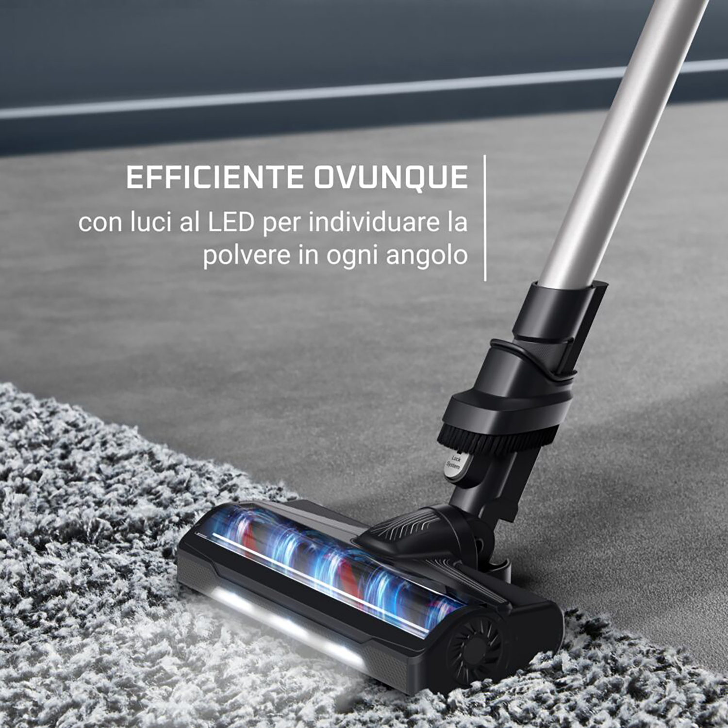 Testa dell'aspirapolvere che pulisce un tappeto, con luci e testo italiano.