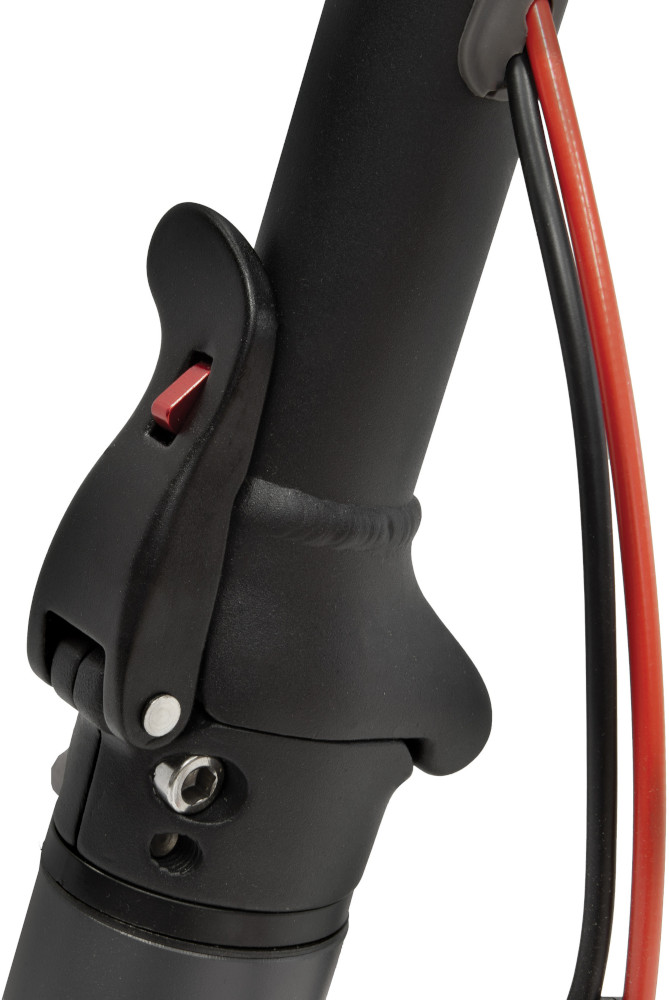 Close-up of black scooter parts, showing the folding mechanism with a red button and some cables.
