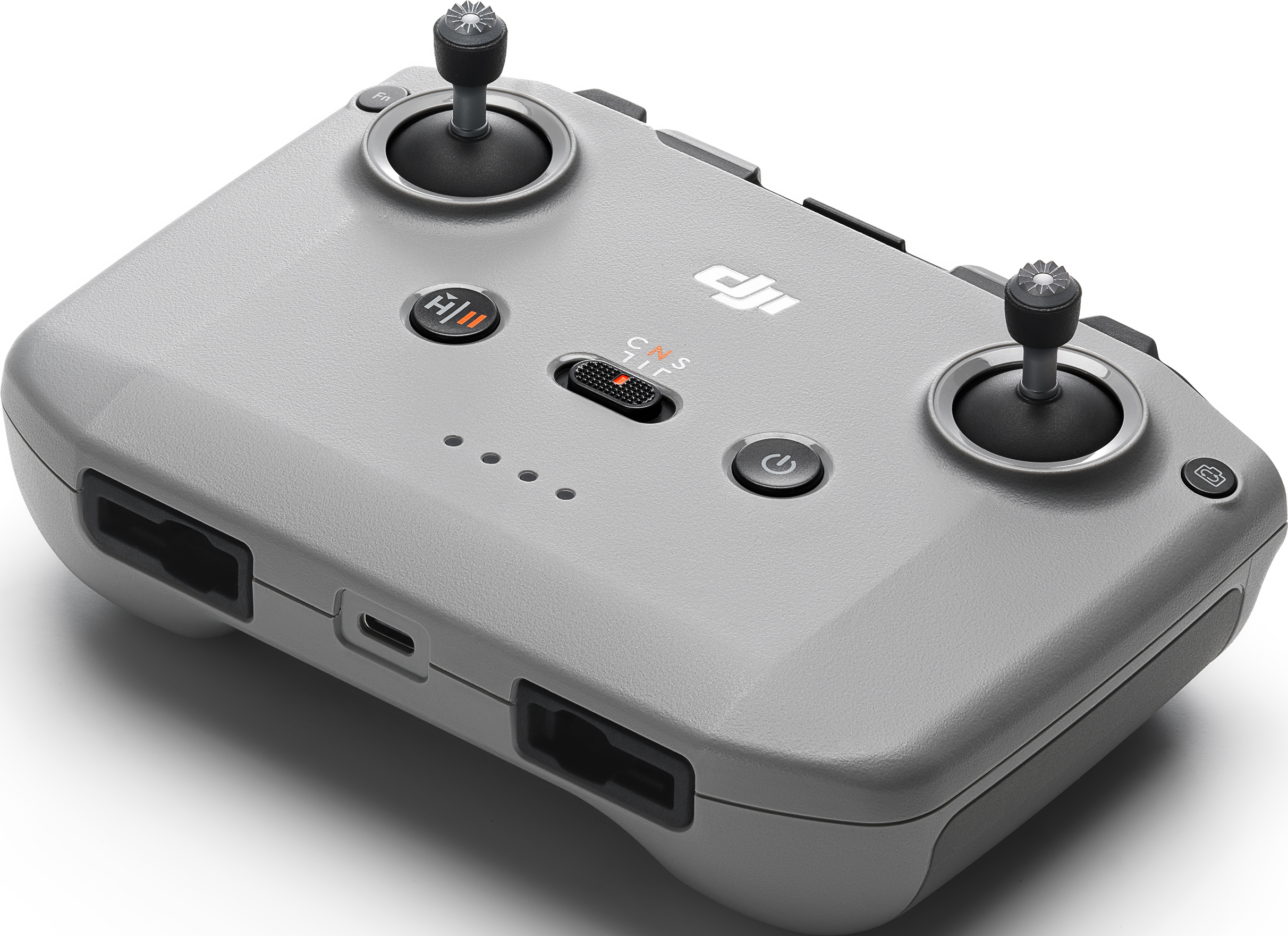 Une manette de drone grise avec des joysticks et des boutons. La marque n'est pas visible.