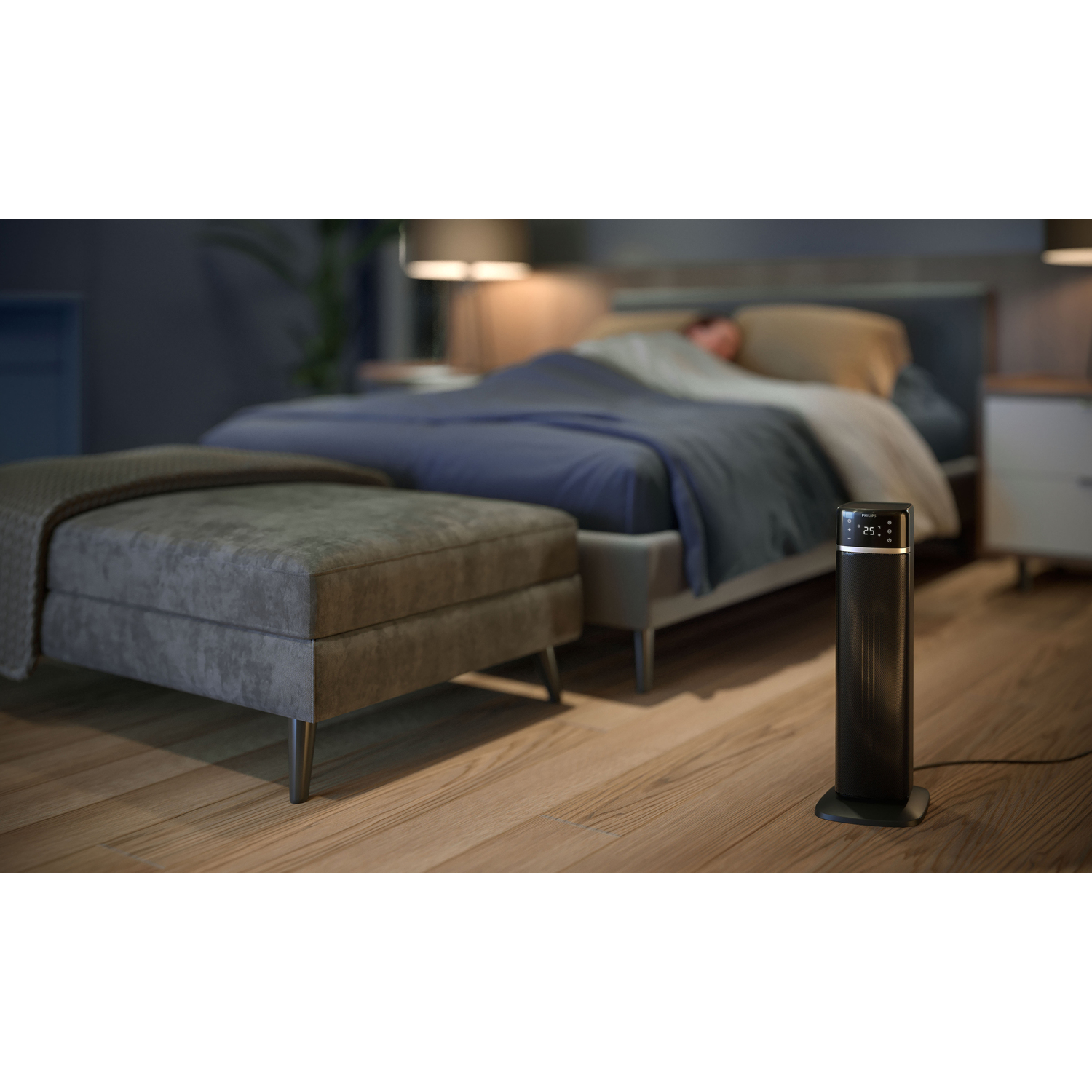 Black space heater with a digital display in a bedroom with a person sleeping.