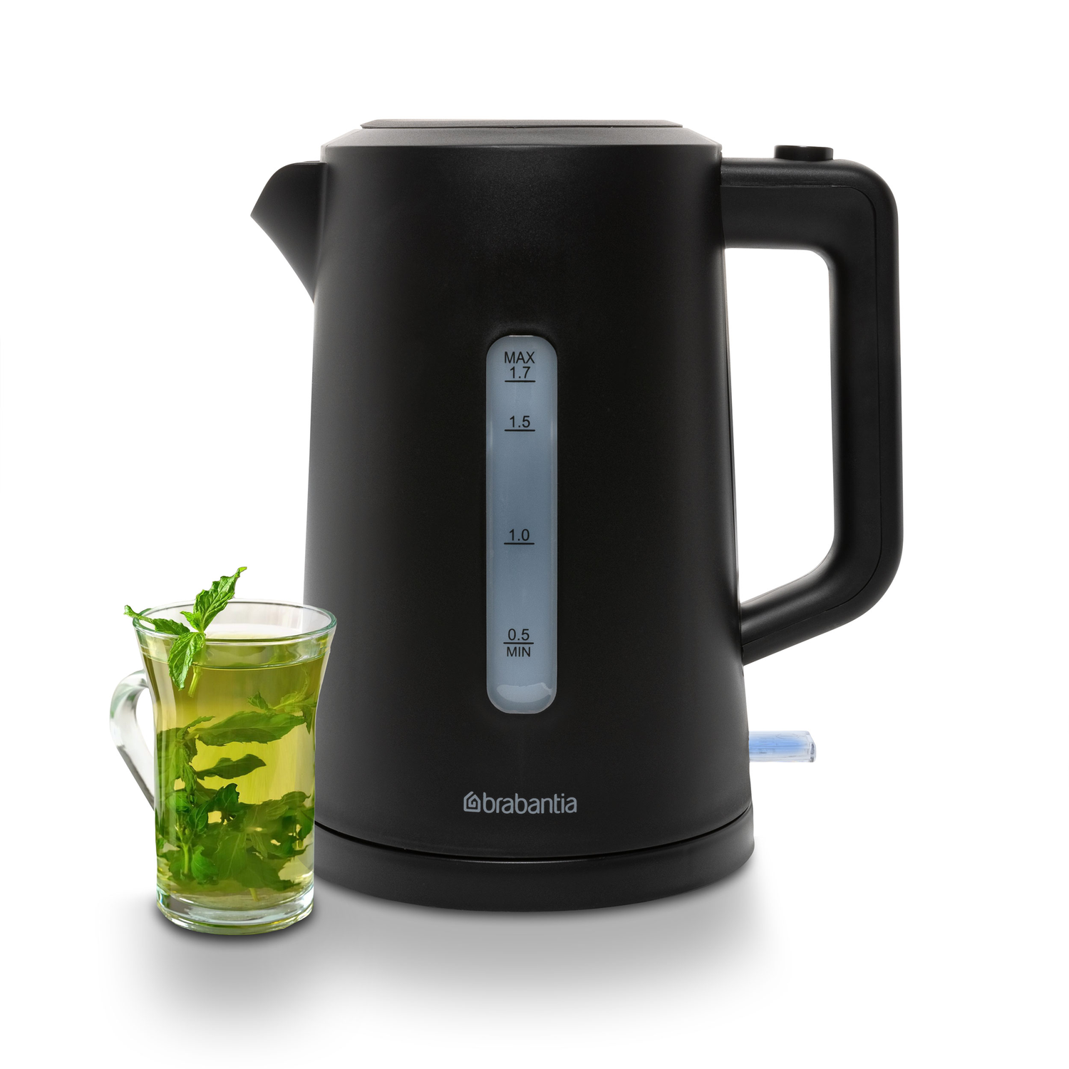 Black electric kettle with a full water level indicator and a glass of tea.