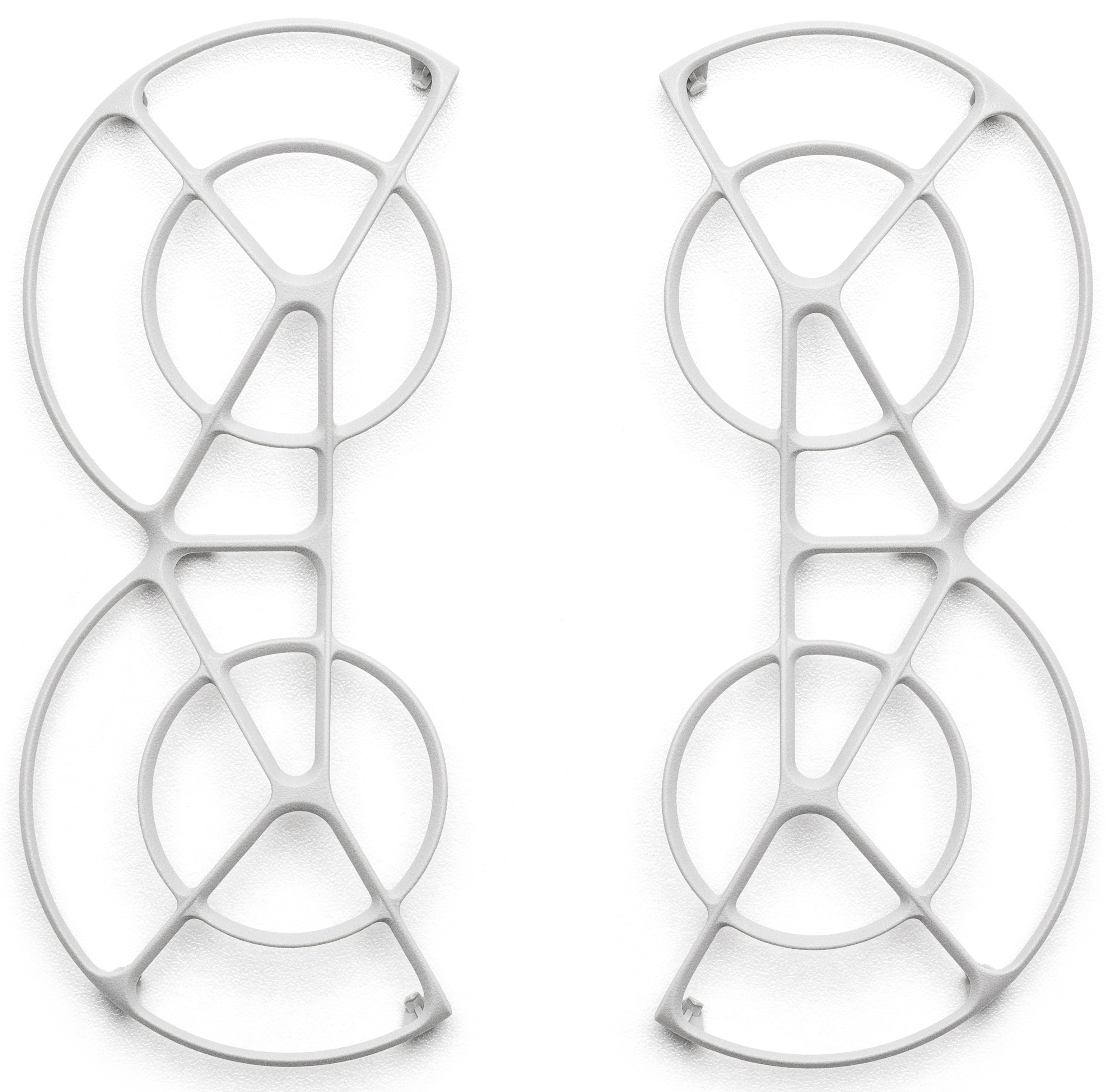 Dwie białe osłony śmigła drona, każda z okrągłym i półokrągłym elementem.