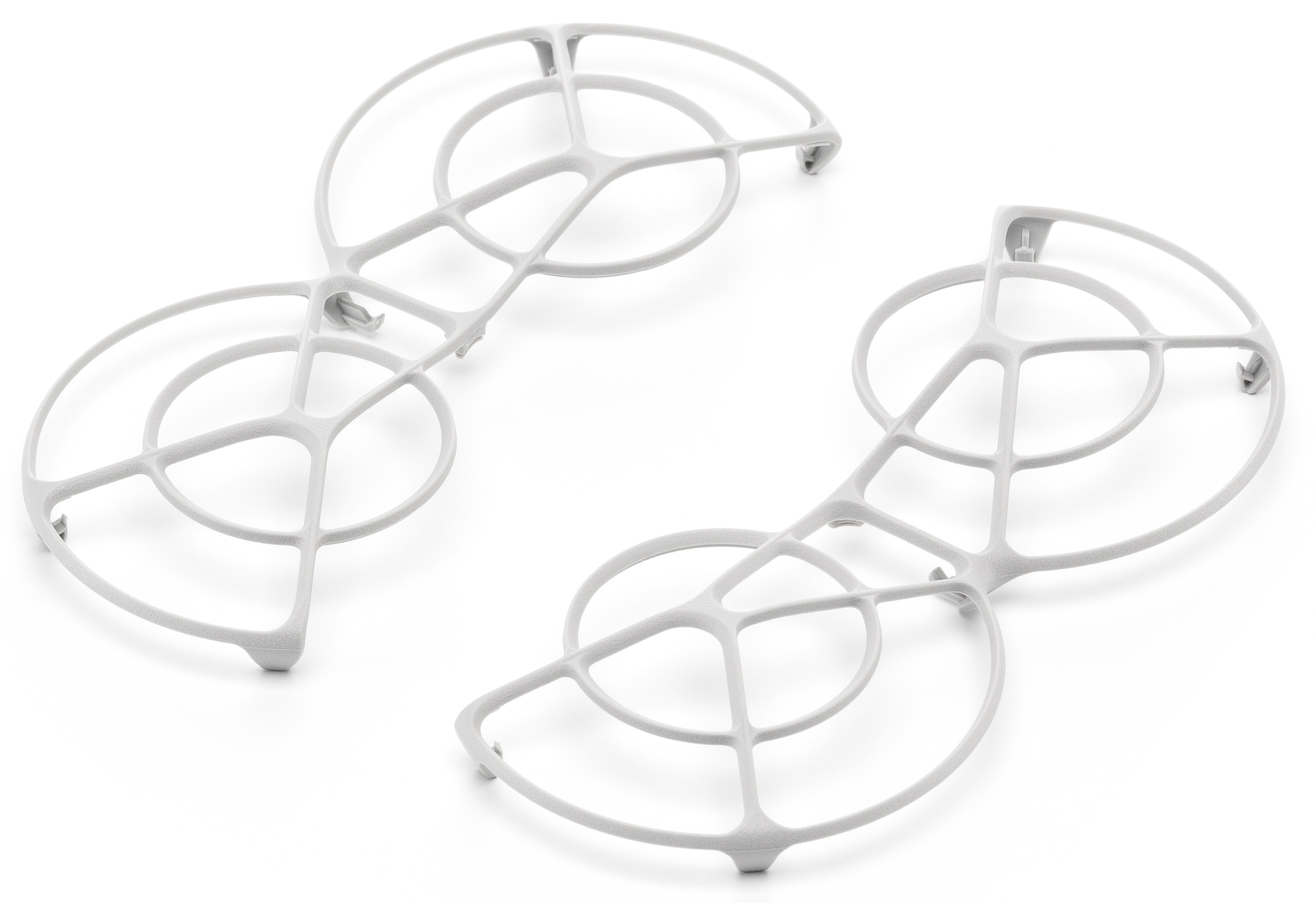 Dwie jasnoszare, ażurowe okrągłe ramy, każda z centralnym pierścieniem połączonym cienkimi wspornikami.
