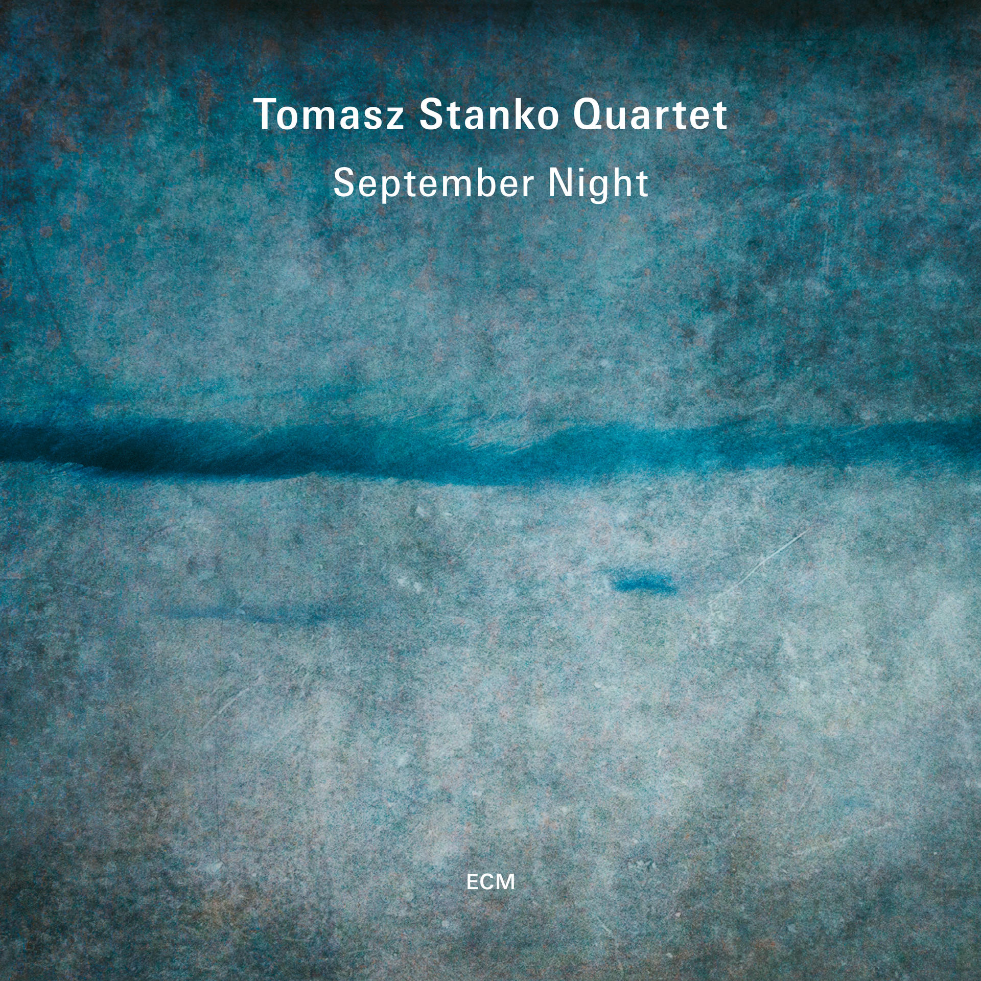 Album borító kék textúrájú háttérrel és szöveggel a Tomasz Stanko Quartet számára.