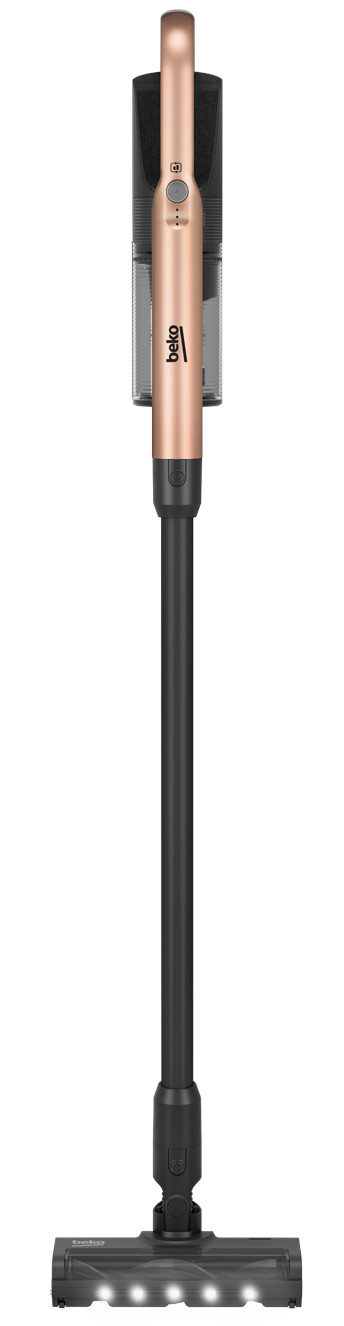 Pionowy odkurzacz. Główny korpus w kolorze różowego złota. Długi czarny drążek z głowicą szczotkową. Czarne akcenty.
