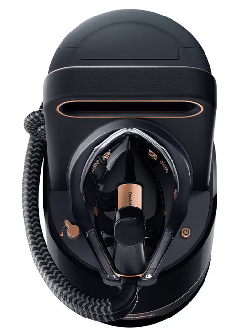 Czarny i różowo-złoty żelazko z generatorem pary. Widok z góry, z kablem i widocznymi elementami sterowania.