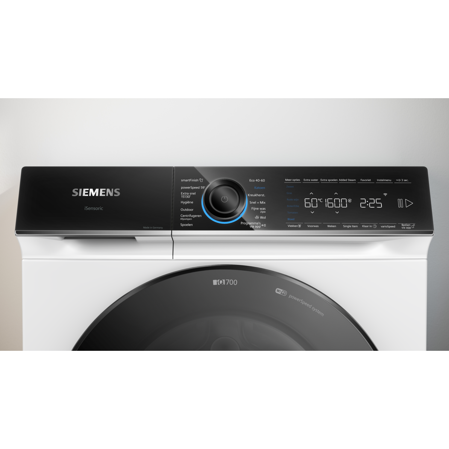 Siemens washing machine control panel. Black panel, white body. Display shows settings and options.