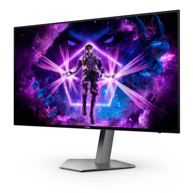 Un monitor de juegos muestra una escena futurista con un personaje en un fondo brillante, morado y temático espacial.