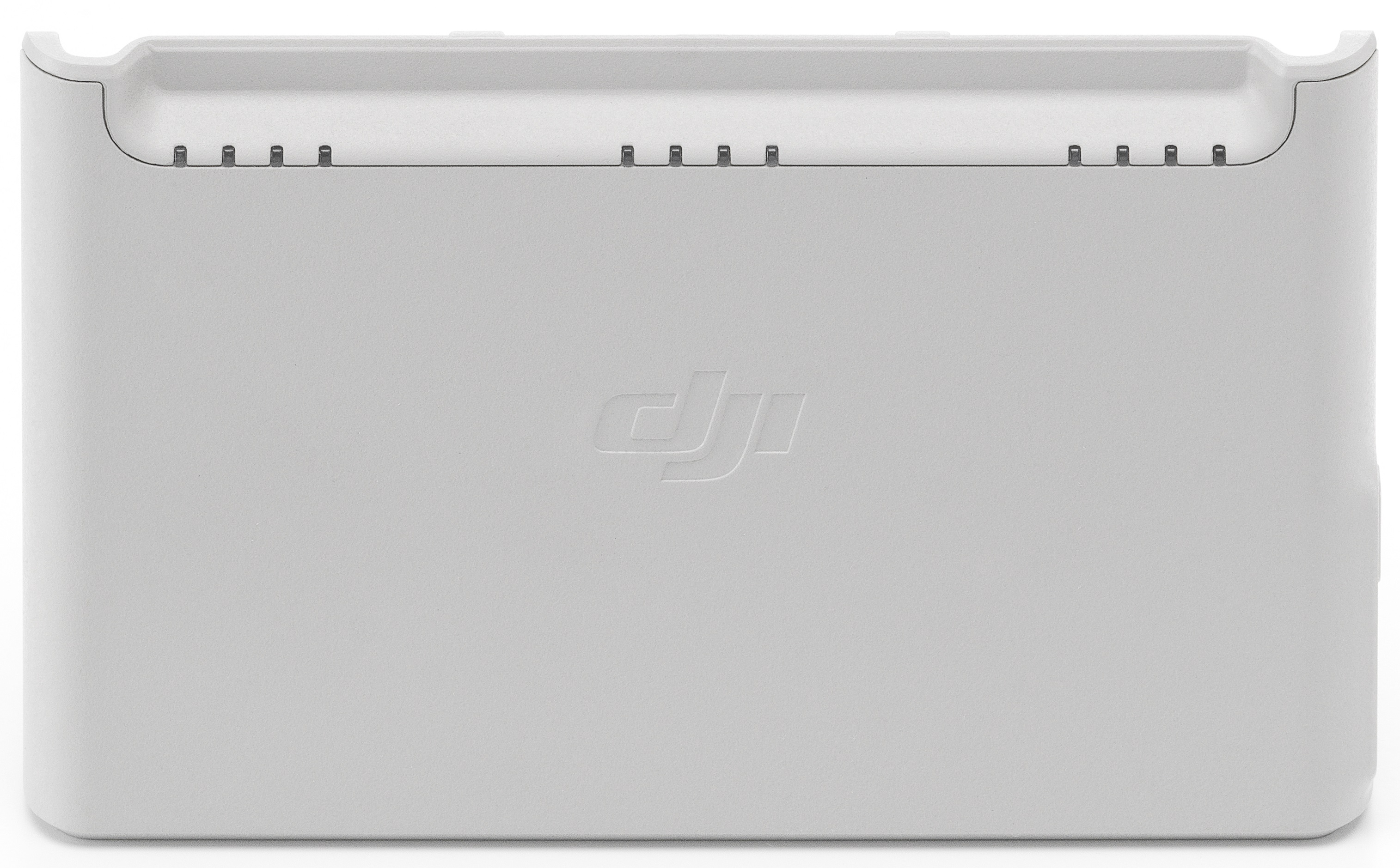 Biała stacja ładująca baterie do drona DJI.