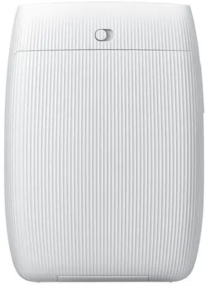 Un appareil blanc, cylindrique, avec des rainures verticales et un petit bouton en haut. Il a un design épuré et moderne.