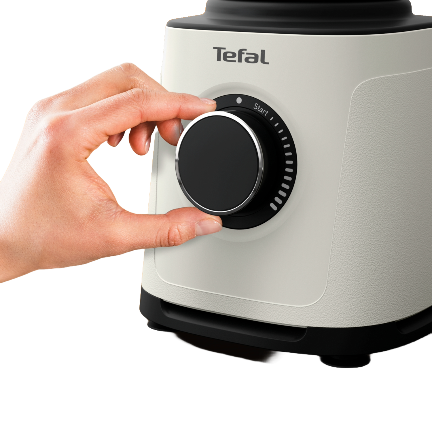 A person's hand adjusting a dial on a white and black appliance.