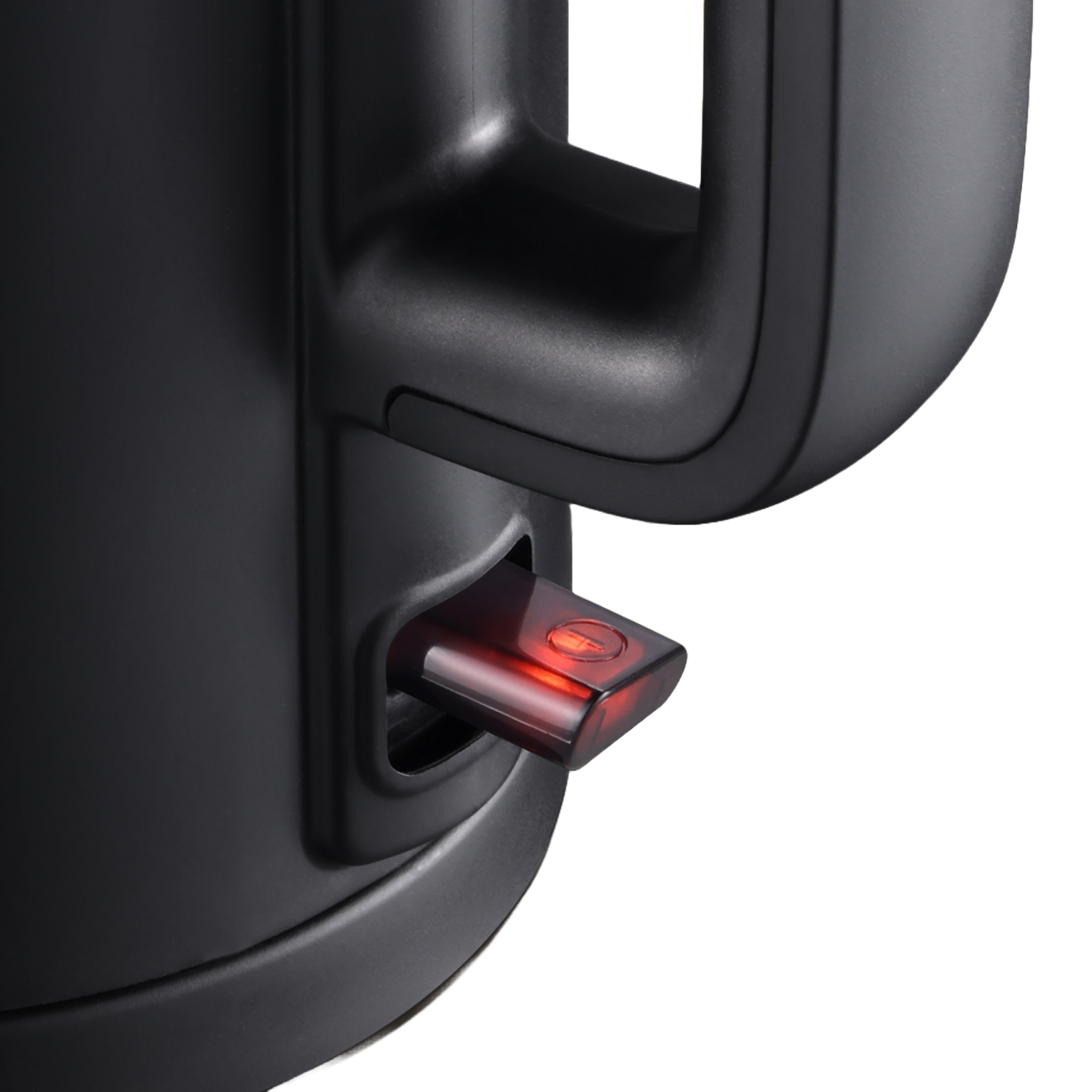 Close-up of a black electric kettle with a red power button illuminated.
