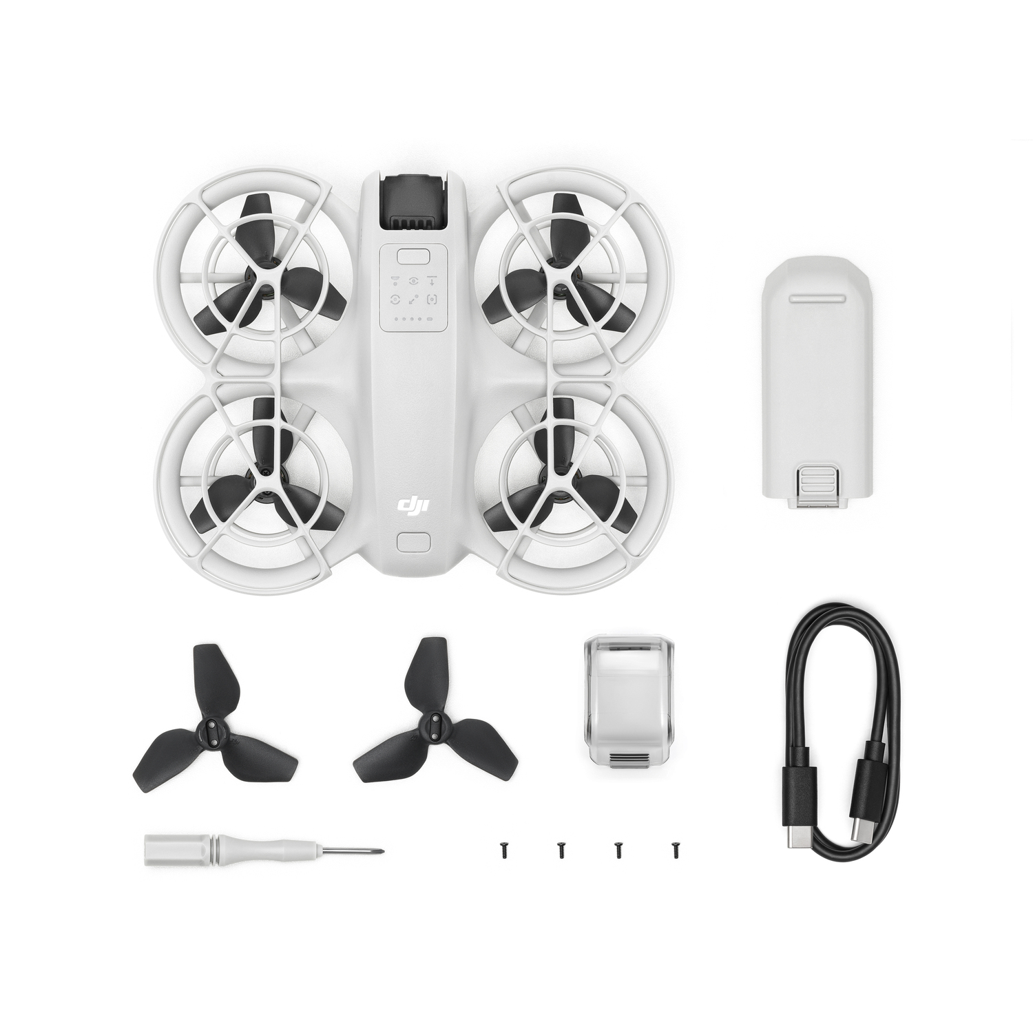 A white DJI drone with accessories on a white surface.