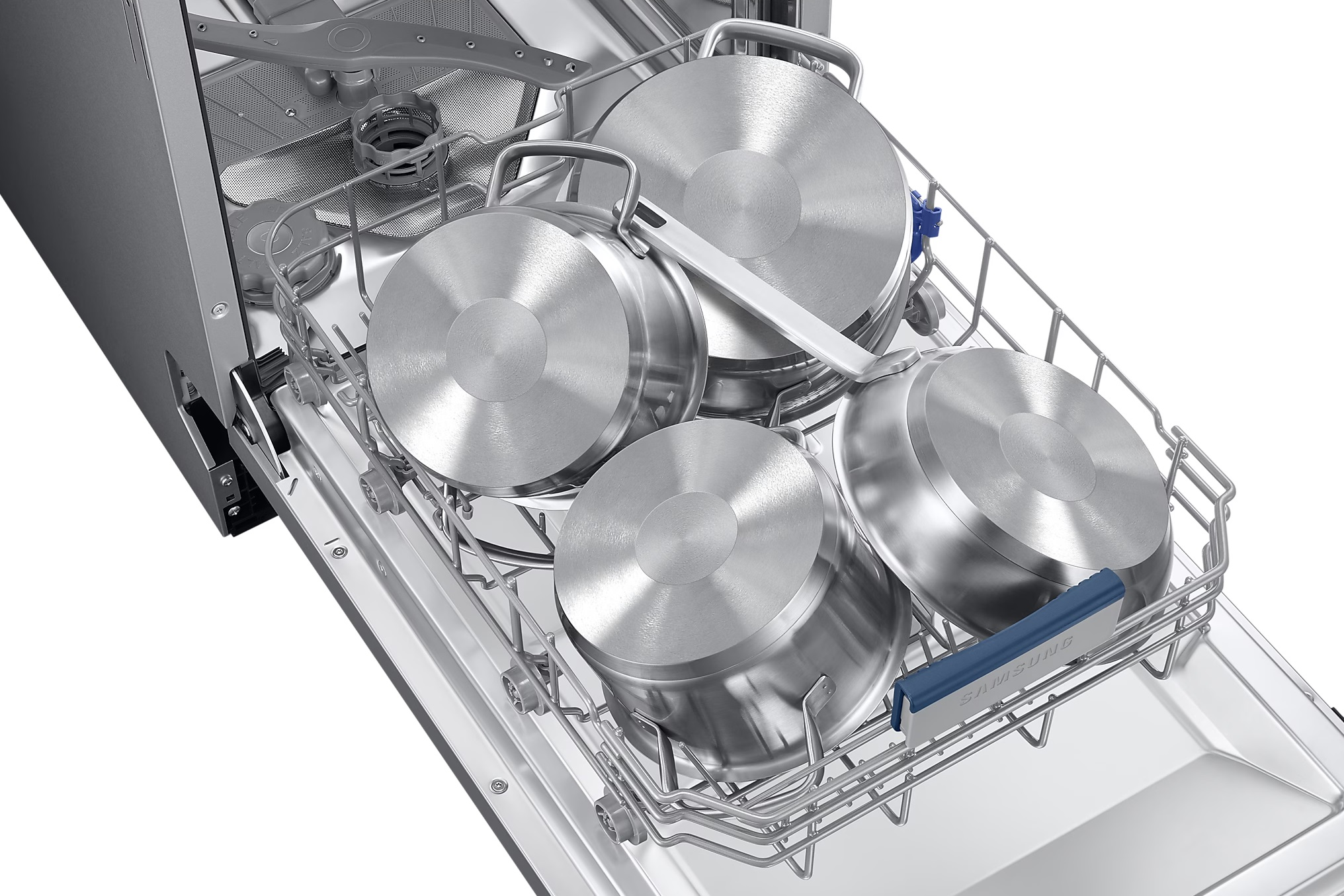 Garnki i chochla w zmywarce. Garnki ze stali nierdzewnej są w stojaku.