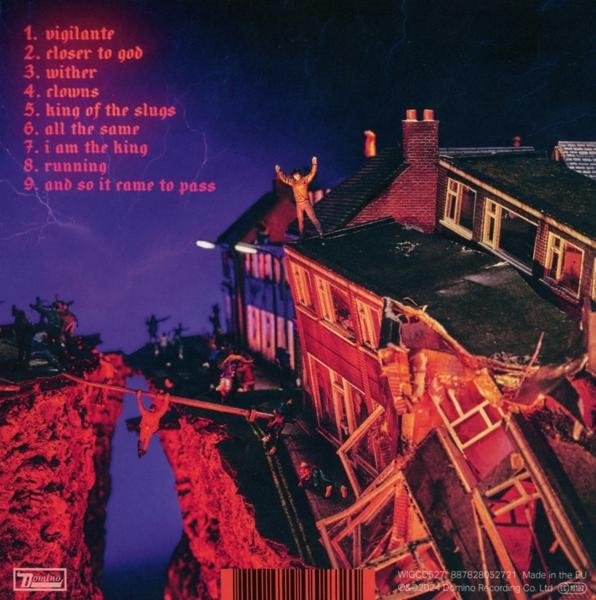 Albumcover eines Modellhauses mit einem Mann oben drauf. Titelliste.