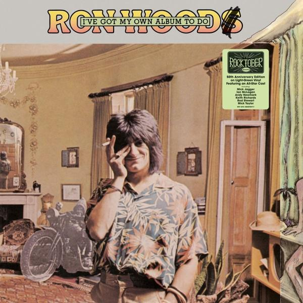 Albumcover: Mann mit Zigarette, 'Ron Wood' und 'Rocktober' Aufkleber.