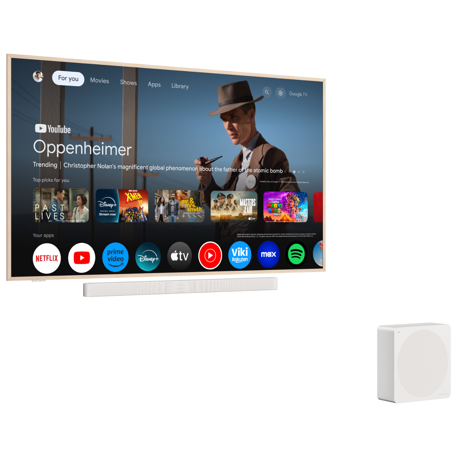 A TV displays a movie scene. Below are streaming apps, a soundbar, and a white subwoofer.