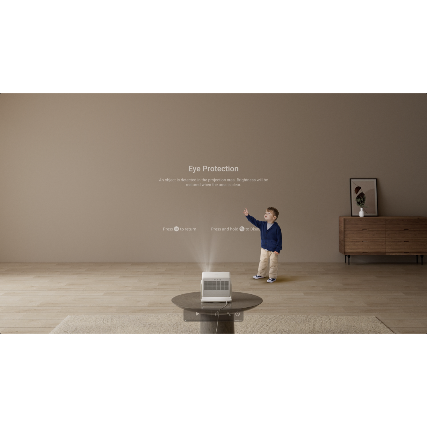 A child pointing upwards towards a projected image in a room with a wooden cabinet.