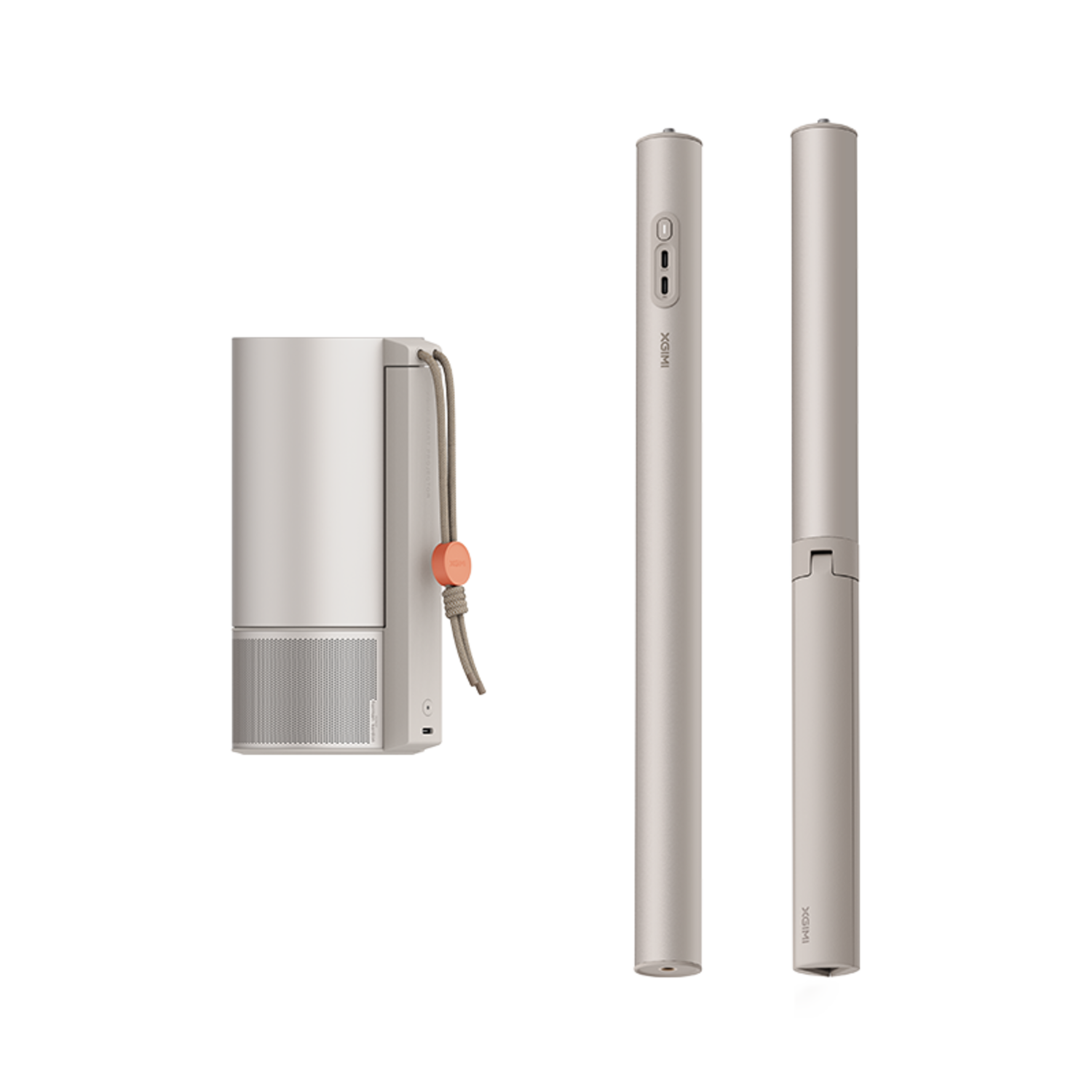 Three light gray cylindrical items, one with a cord and orange detail, on a black background.